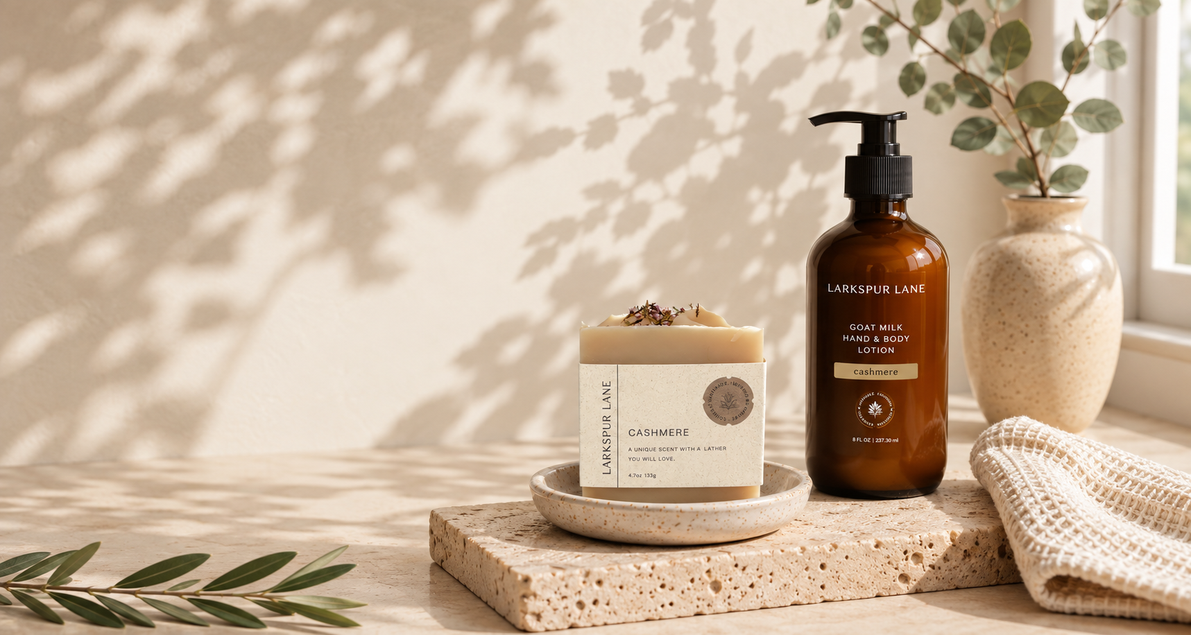 Cashmere handmade soap and goat milk lotion displayed in a warm farmhouse setting